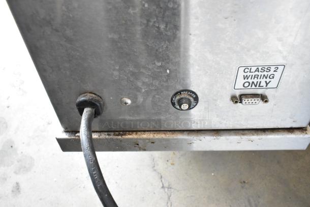 Curtis ILGD-10 stainless steel coffee bean grinder, 120 volts, with visible "Class 2 Wiring Only" label.