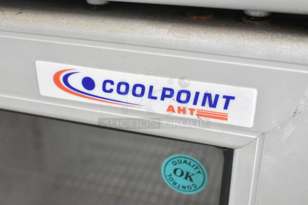 AHT Coolpoint CMV 50 mini cooler merchandiser, 115V, 1 phase. Features metal single door, visible quality control sticker.