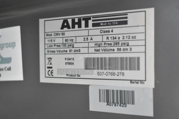 AHT Coolpoint CMV 50 Mini Cooler Merchandiser, 115V, label with specs including model, voltage, and capacity details.
