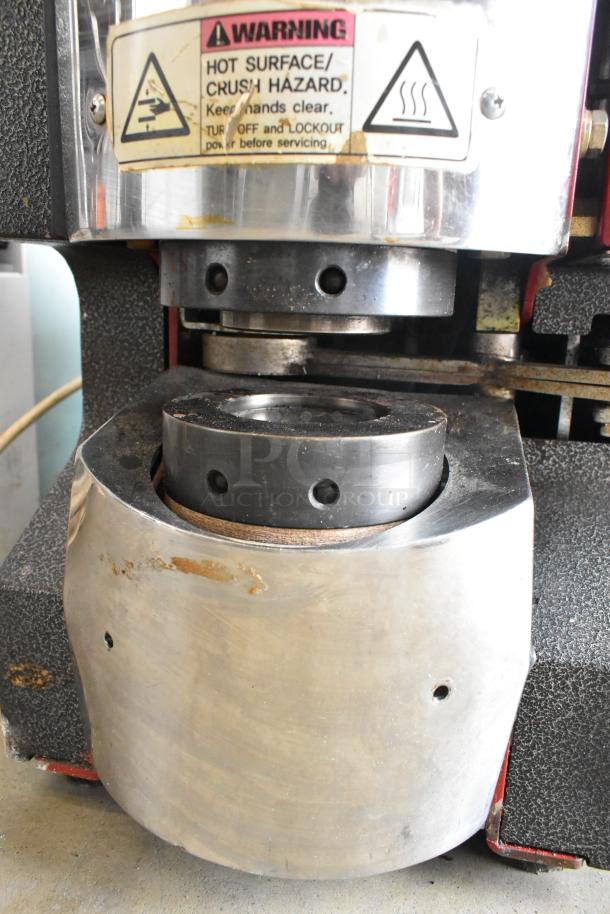 Magic Pop DMP-1 Metal Commercial Rice Cake Machine with visible warning label. 115 Volts, 1 Phase. Industrial condition.