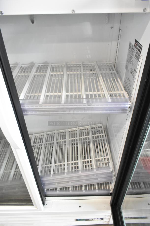 2019 True ZGDM-36SL-HC-LD two-door reach-in cooler with poly-coated racks, 115V, 1 phase, excellent condition.