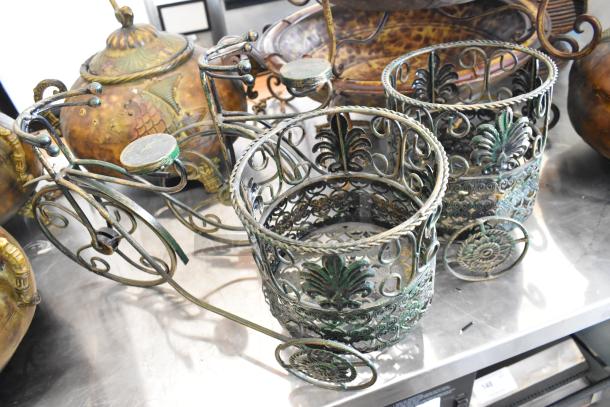 Set of 9 decorative items, featuring ornate metal vase holders and intricate finials. Perfect for home decor.
