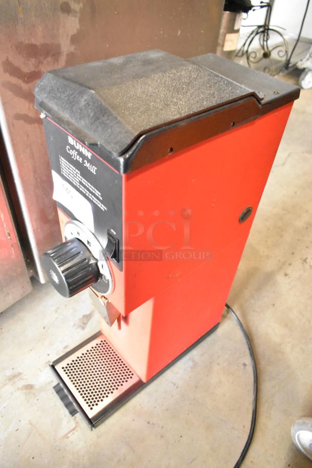 Bunn Metal Commercial Coffee Bean Grinder, red, countertop model, 120V, 1 phase, visible dial, used condition.
