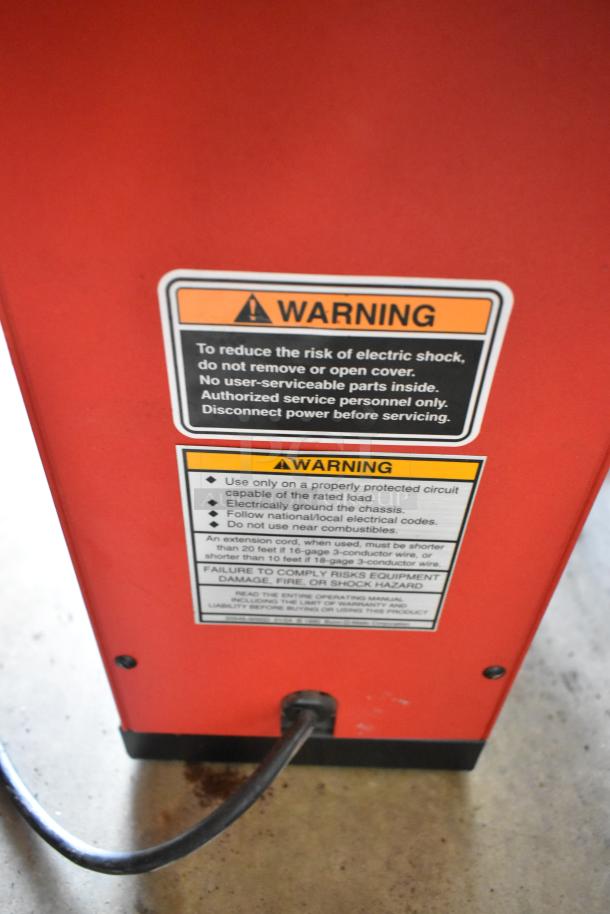 Bunn Metal Commercial Coffee Grinder, countertop model, 120V, 1 phase. Warning labels visible on red exterior.