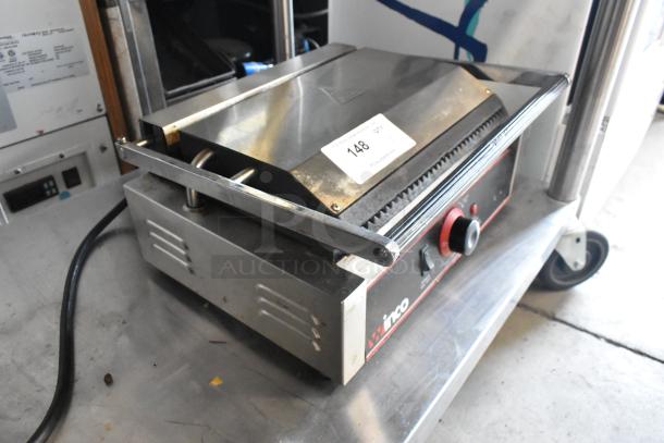 Winco EPG-1 stainless steel commercial countertop Panini press, 120V, features adjustable handle, with control knobs.
