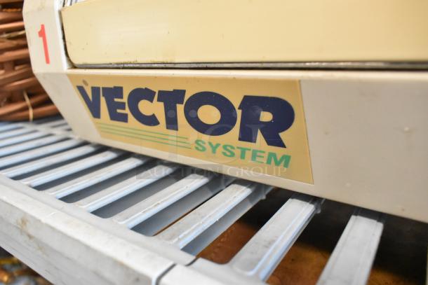 Vector E123180 Bug Zapper, cream color, visible logo, on metal rack. Includes baskets. Used condition.