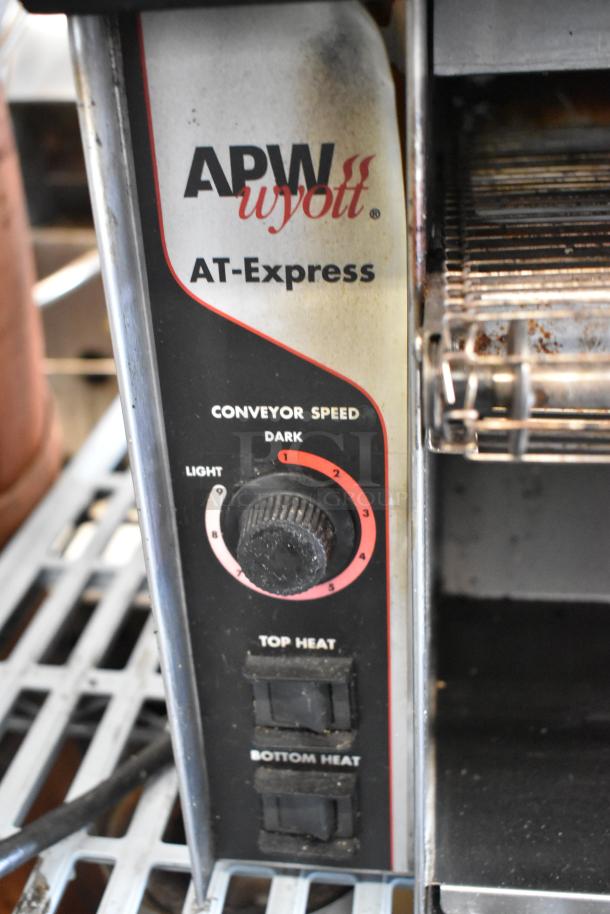 APW Wyott AT EXPRESS conveyor toaster oven, stainless steel, 240V, used condition, adjustable heat and speed settings.
