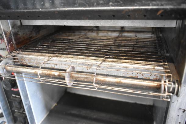 APW Wyott AT EXPRESS stainless steel countertop conveyor toaster oven, used condition, 240V, 1 phase, visible wear, rust spots.