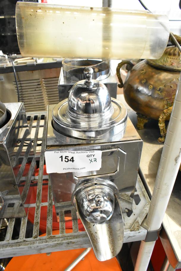 Two metal dry dispensers with chrome finish, dome tops, and spouts. Quantity tag reads "154 QTY x2." Ideal for efficient dispensing.