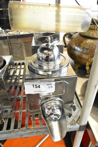 Two metal dry dispensers with chrome finish, dome tops, and spouts. Quantity tag reads "154 QTY x2." Ideal for efficient dispensing.