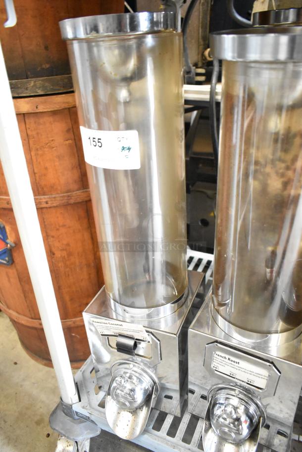 Three metal dry dispensers with clear cylinders and chrome bases, labeled for coffee varieties. Includes auction tag #155.