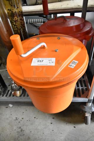 Orange Poly lettuce spinner salad spinner with handle; auction label 157; bid quantity 2; used condition.