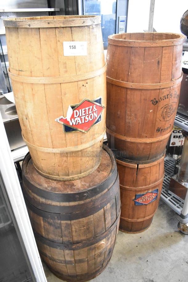 Four wooden barrels, marked with "Dietz & Watson" logos, varying in wood tone and band condition. Item 158, QTY 4.