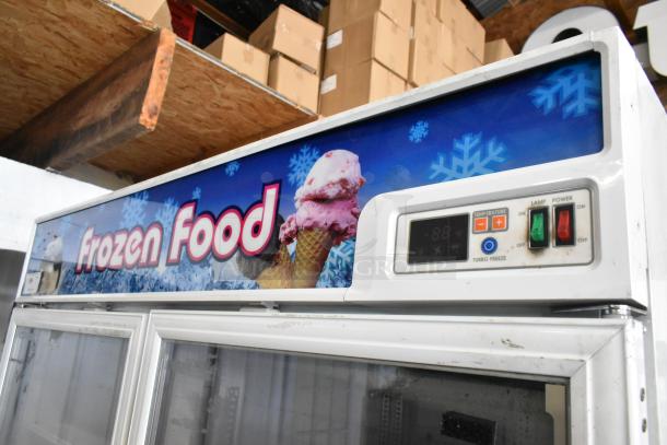 Turbo Air TGF-49F 2-door freezer merchandiser with controls and "Frozen Food" display, on commercial casters.