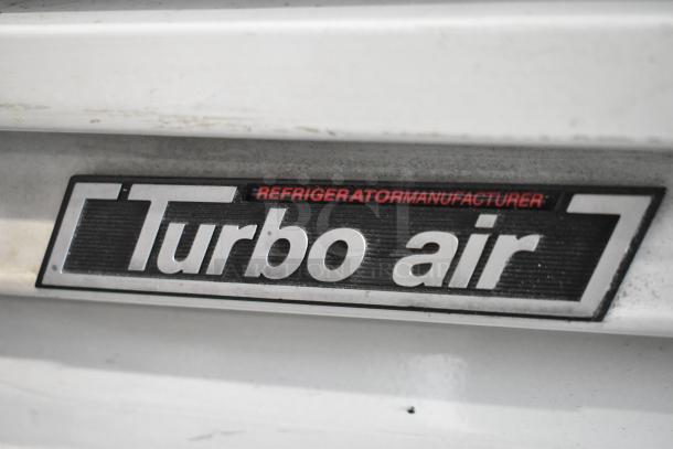 Turbo Air TGF-49F commercial reach-in freezer, metal, 2 doors, poly coated racks, on commercial casters, 115V, 1 phase.
