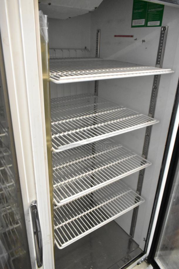 Turbo Air TGF-49F commercial freezer, 2 glass doors, poly-coated racks, on casters, 115V, 1 Phase.