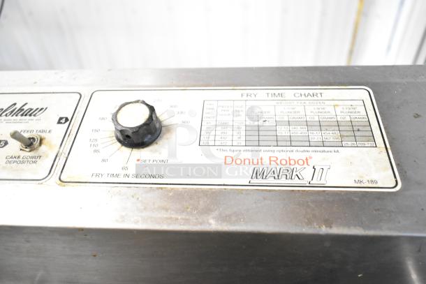 Belshaw Mark II Stainless Steel Commercial Donut Robot with fry time chart and control knob, model Mark II, in used condition.