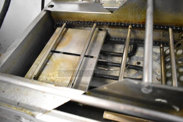 Belshaw Mark II stainless steel donut robot, commercial countertop model. Visible signs of use and grease build-up.