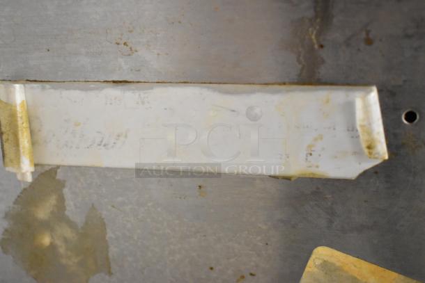 Belshaw Mark II Stainless Steel Donut Robot; used condition, surface wear, partial label visible.
