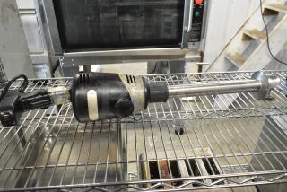Waring WSB Commercial Immersion Blender, 120 Volts, 1 Phase. Black motor housing, stainless steel shaft, used condition.