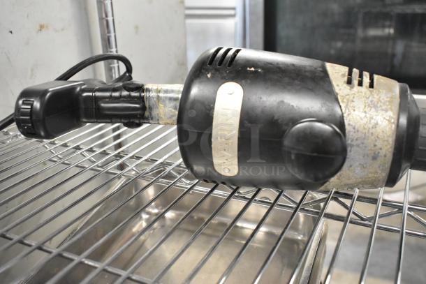 Waring WSB Commercial Immersion Blender, black handle, visible wear. Model WSB, 120 volts, 1 phase, branded label.