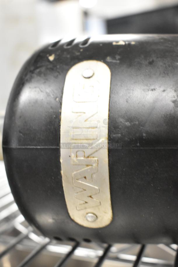 Waring WSB Commercial Immersion Blender, 120 Volts, 1 Phase, shows "Waring" logo on black housing, moderate wear.