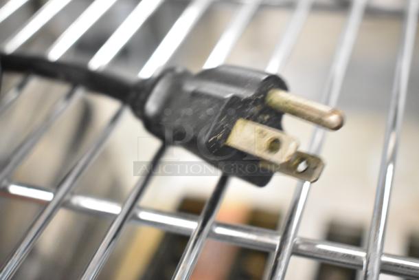 Close-up of a plug for the Waring WSB Commercial Immersion Blender, 120 Volts, 1 Phase. Black, three-prong design.