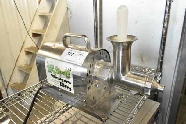 Dr Squeeze stainless steel wheatgrass juicer, commercial countertop model, 115 volts, 1 phase, with visible label and auction tag.