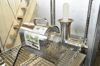 Dr Squeeze stainless steel wheatgrass juicer, commercial countertop model, 115 volts, 1 phase, with visible label and auction tag.