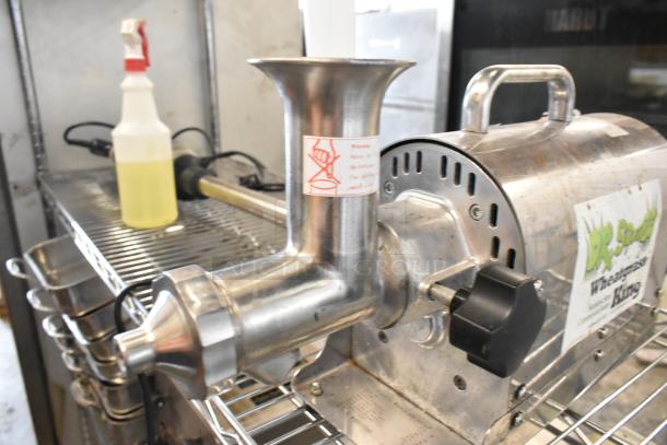 Dr Squeeze stainless steel wheatgrass juicer, 115 volts, 1 phase. Features warning label, used condition.