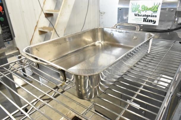 Eight Cuisinart metal baking pans, stainless steel, durable, good condition, perfect for baking needs.