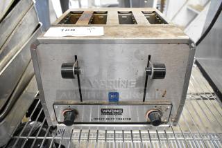 Waring WCT825 stainless steel 4-slot toaster, heavy-duty, 240 volts. Features adjustable knobs, NSF certified, fair condition.