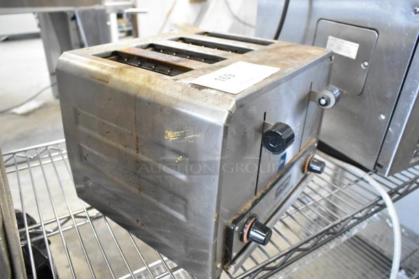 Waring WCT825 Stainless Steel 4 Slot Heavy Duty Toaster, 240 Volts. Visible wear on exterior.