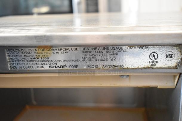 Sharp R-23GT-F stainless steel commercial microwave, 208/230V, 1 Phase, UL and NSF listed, made in March 2006.