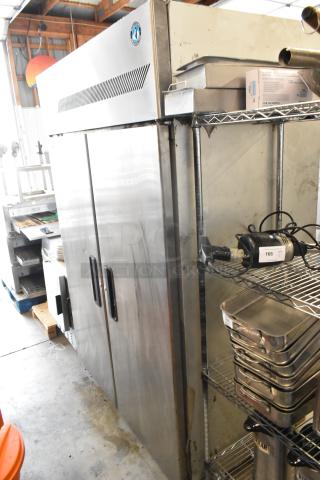 Hoshizaki FH2-AAC stainless steel 2-door reach-in freezer with poly coated racks, on commercial casters, 115V, 1 phase.