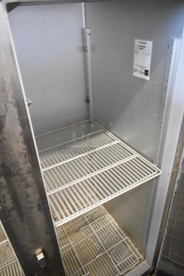 Hoshizaki FH2-AAC stainless steel commercial 2-door reach-in freezer, poly-coated racks, commercial casters, 115V, 1 phase.