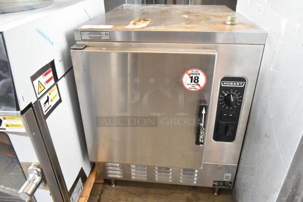 Hobart HC24EA5 stainless steel commercial steam cabinet, electric powered, single deck, visible controls and operating sticker.