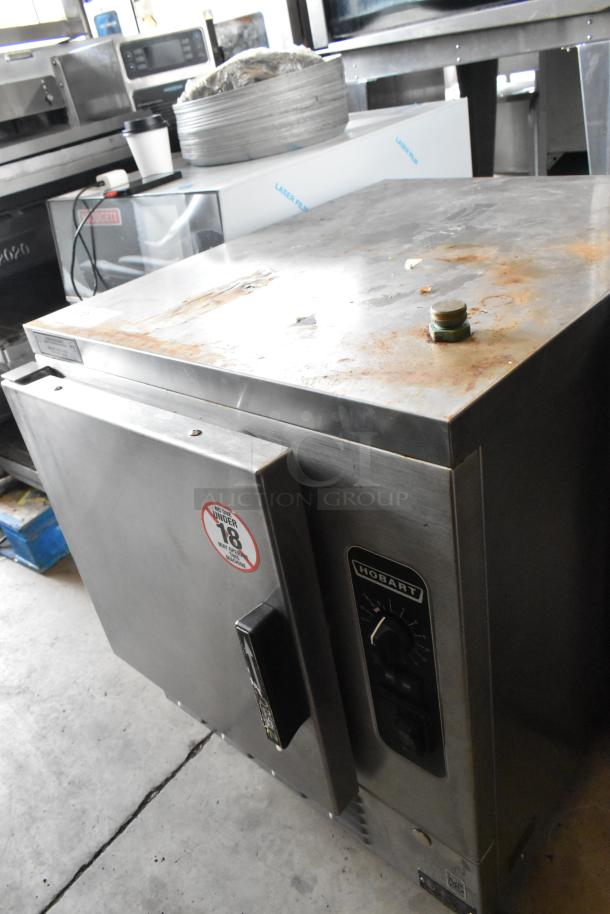 Hobart HC24EA5 stainless steel steam cabinet, single deck, electric, 208/240V, visible rust on top, intact controls.