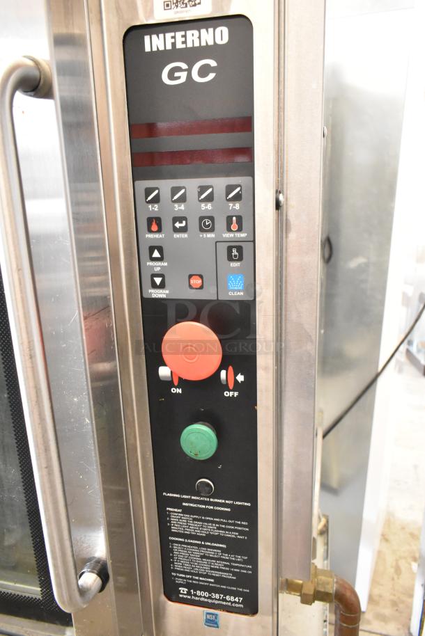 Hardt GC/4000 stainless steel rotisserie oven with control panel. Natural gas powered, commercial grade, on metal legs with casters.