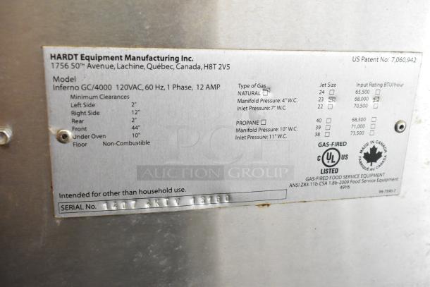 Hardt GC/4000 stainless steel commercial rotisserie oven label. Shows gas type, clearances, and usage details.