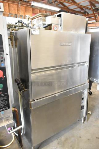 Hobart UW50 stainless steel commercial utensil washer with split door design. Features 208 volts, 3-phase power.