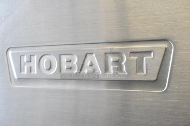 Hobart UW50 stainless steel utensil washer, split door design, 208V, 3 phase, embossed logo detail.