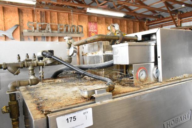 Hobart UW50 stainless steel commercial utensil washer, split door. 208V, 3 phase. Shows signs of heavy use.