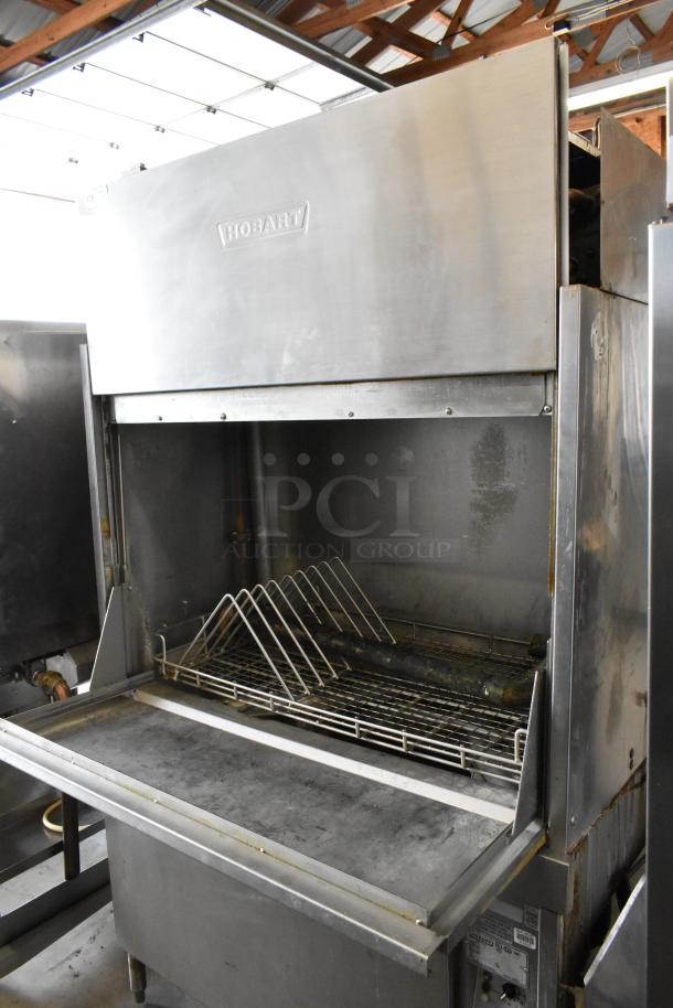 Hobart UW50 stainless steel commercial utensil washer with split door design, showing interior rack, 208V, 3-phase.