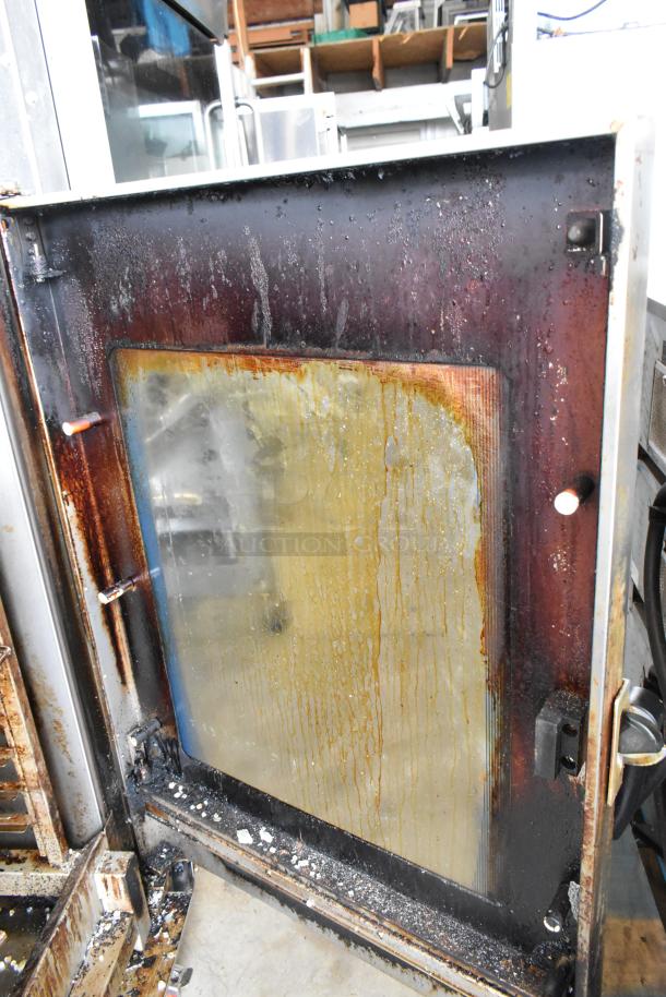 Alto Shaam 12.20ESI-SK electric convection oven. Stainless steel, 208-240V, 3 phase. Used condition, visible interior wear.