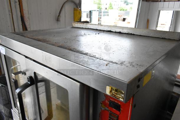 Vulcan SG4D-1 stainless steel full-size convection oven with view-through doors. Metal racks, thermostatic controls. Bottom doors stuck.
