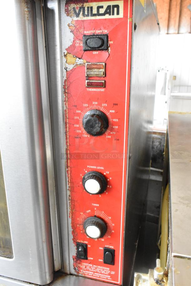 Vulcan SG4D-1 stainless steel convection oven with thermostatic controls, view-through doors, and metal racks. Bottom doors stuck.