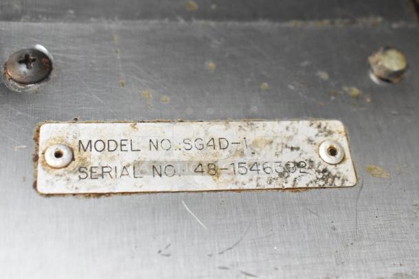Stainless steel model label on Vulcan SG4D-1 convection oven, showing model and serial numbers. Slightly worn condition.