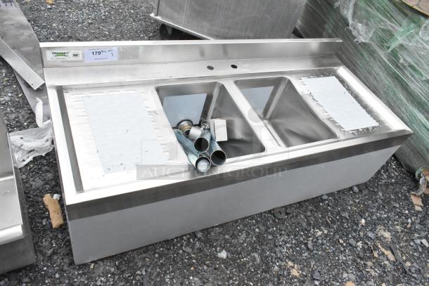 Brand new Regency 600B22148213 underbar sink, 48"x21", two bowls, two 13" drainboards, minor scratches, included fittings.