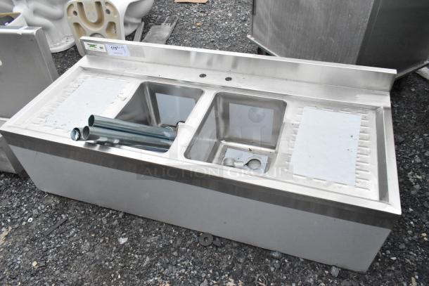 BRAND NEW Regency 48" x 21" two-bowl underbar sink, model 600B22148213, with two 13" drainboards. Scratch and dent condition.